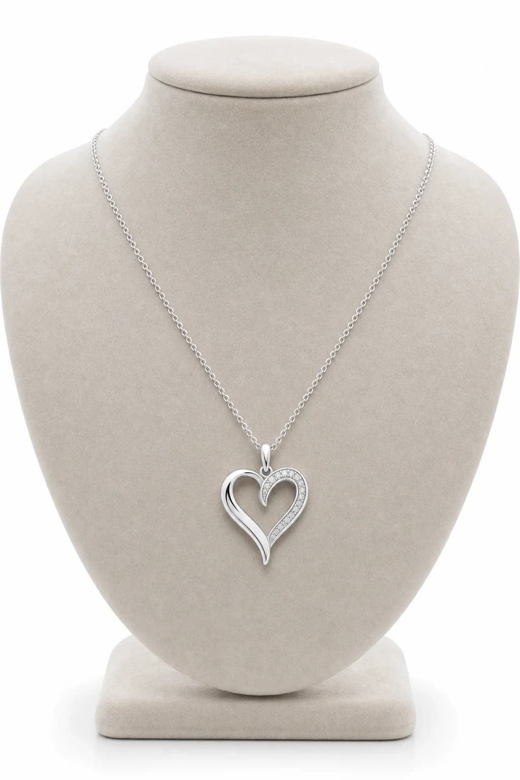 Silver heart pendant necklace photographed in a premium studio setting